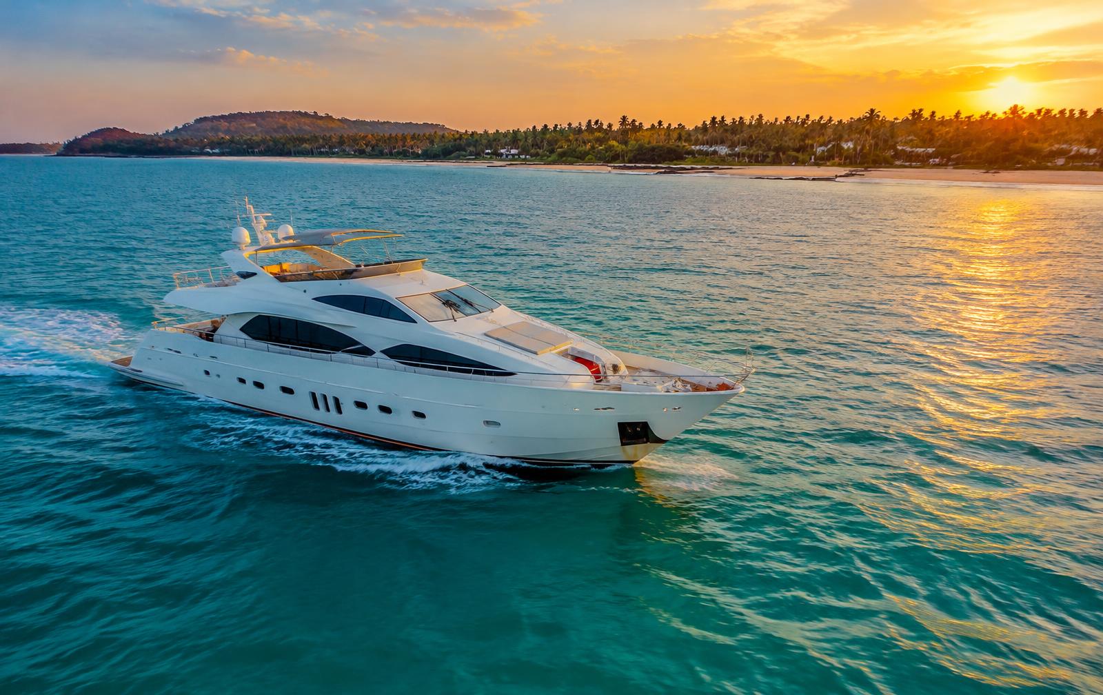 Luxury yacht sailing off the Goa coast at sunset